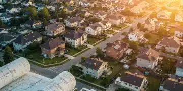 Diverse housing developments under a hopeful sky, symbolizing a new federal initiative.